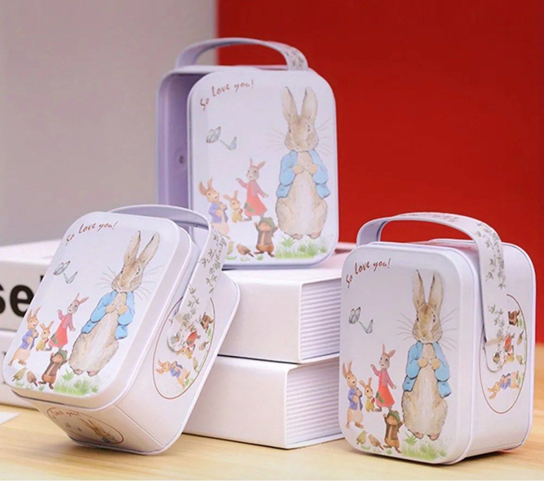 Bunny Print Metal Storage tin can with Handle (Category: Food Organization & Storage) located in Makati City. Submitted by humilityandkindness (Listing ID 1360502933, Image 3). Description: On hand!!! 7 pcs left Vintage Tin Metal Candy Box with Rabbit and Youngsters Design - Durable Small Storage Suitcase, Ideal for Biscuits, Candy, Cosmetics, and Gifts, Decorative Cartoon Illustrations, Gift Storage Box|Whimsical Illustrations|Tin Metal Box East
