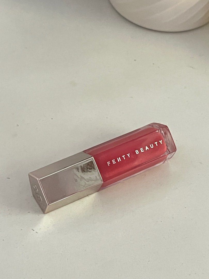 Fenty Beauty Gloss Bomb Dragon Miami (Category: Makeup) located in Paranaque City. Submitted by discodaydream (Listing ID 1360563315, Image 2). Description: Fenty Beauty Gloss Bomb in NEW SHADE: Dragon Mami (see last pics for when worn and item from others) Full size 9ml 100% guaranteed authentic Bought by my sister in Sephora Dubai Brand new, swatched once only Sep is around P1600/1700.