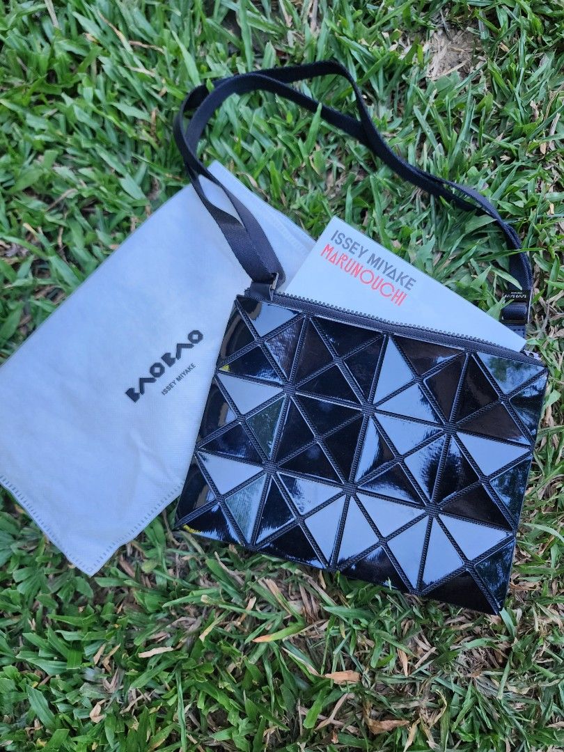 Issey Miyake Lucent Black Cross-Body Bag (Category: Cross-body Bags) located in Pasig City. Submitted by ethpee (Listing ID 1360436241, Image 3). Description: Authentic, Like new, handled with care with no damages and scratches. Complete inclusions with guarantee card, shop tag, and dust bag. Bought in Issey Miyake store in Marunouchi, Japan last 2019 for reference. Price is slightly negotiable!! Meet-ups only for careful product handling. Meet-u