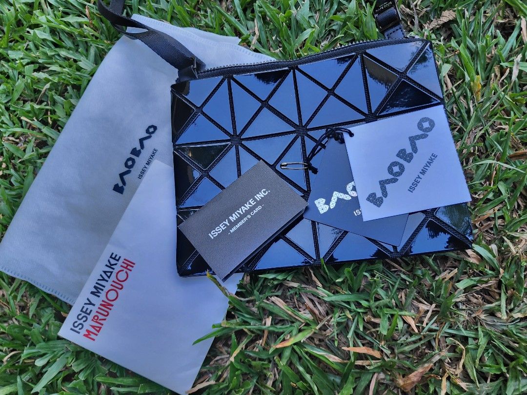 Issey Miyake Lucent Black Cross-Body Bag (Category: Cross-body Bags) located in Pasig City. Submitted by ethpee (Listing ID 1360436241, Image 1). Description: Authentic, Like new, handled with care with no damages and scratches. Complete inclusions with guarantee card, shop tag, and dust bag. Bought in Issey Miyake store in Marunouchi, Japan last 2019 for reference. Price is slightly negotiable!! Meet-ups only for careful product handling. Meet-u