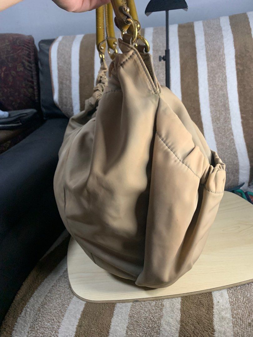 Salvatorre ferragamo hobo shoulder bag (Category: Luxury Bags & Wallets) located in Cabanatuan. Submitted by mjluxxejapan (Listing ID 1360404521, Image 3). Description: Fixed price approx 15”x12” semi large spacious.vintage n ata to nylon makapal matibay material.may Maliliit n dity ga-tuldok lng naman mag ligjt rubs din pati s handle Pero mganda pa to pramis.bawal po s maselan.ung color nya n prang discoloration style nya ata un kasi whole textu