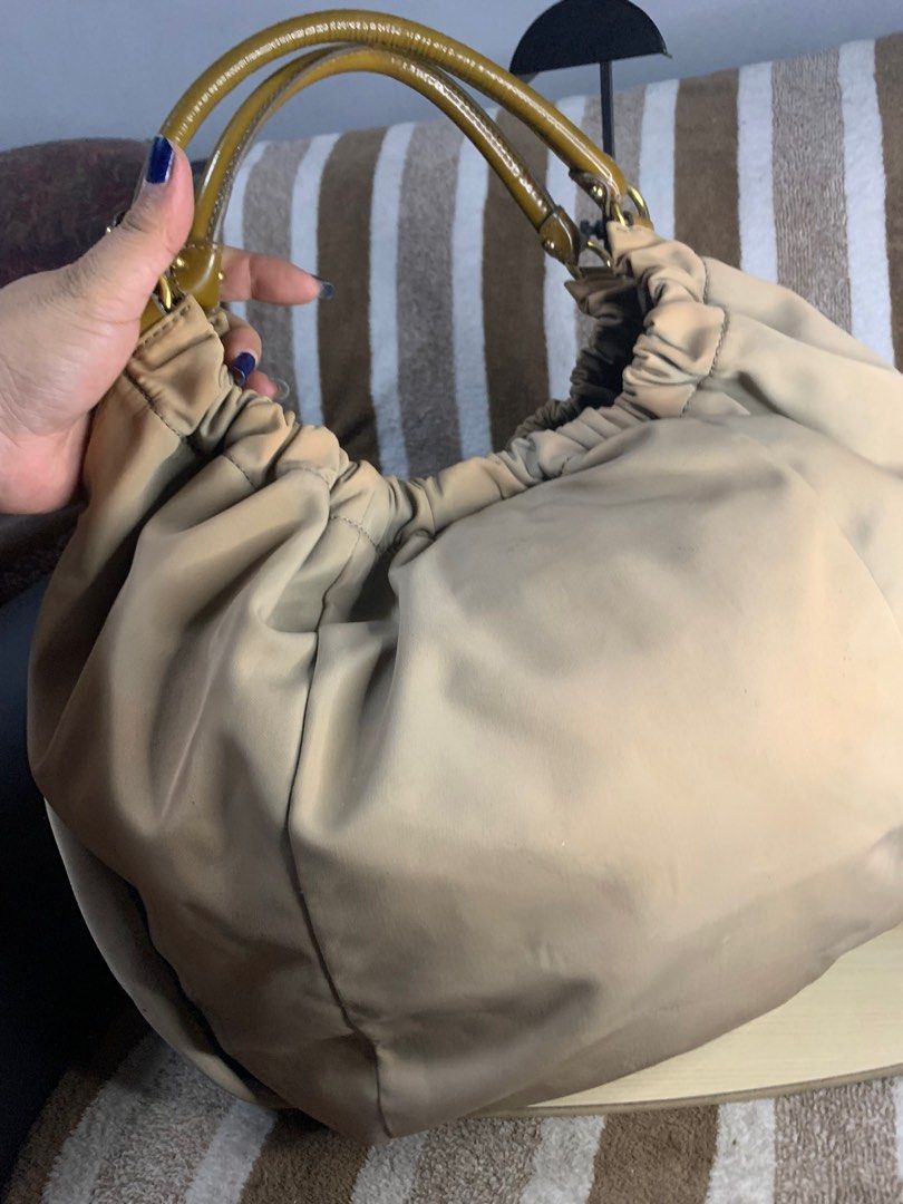 Salvatorre ferragamo hobo shoulder bag (Category: Luxury Bags & Wallets) located in Cabanatuan. Submitted by mjluxxejapan (Listing ID 1360404521, Image 2). Description: Fixed price approx 15”x12” semi large spacious.vintage n ata to nylon makapal matibay material.may Maliliit n dity ga-tuldok lng naman mag ligjt rubs din pati s handle Pero mganda pa to pramis.bawal po s maselan.ung color nya n prang discoloration style nya ata un kasi whole textu