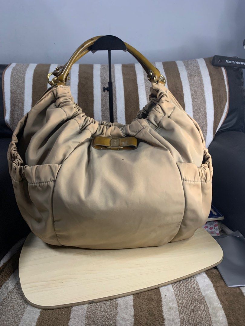 Salvatorre ferragamo hobo shoulder bag (Category: Luxury Bags & Wallets) located in Cabanatuan. Submitted by mjluxxejapan (Listing ID 1360404521, Image 1). Description: Fixed price approx 15”x12” semi large spacious.vintage n ata to nylon makapal matibay material.may Maliliit n dity ga-tuldok lng naman mag ligjt rubs din pati s handle Pero mganda pa to pramis.bawal po s maselan.ung color nya n prang discoloration style nya ata un kasi whole textu