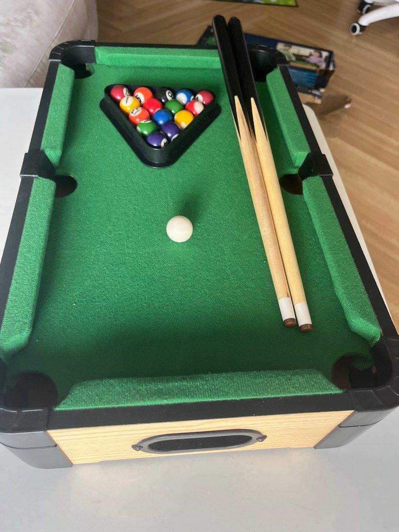 Tabletop Pool Table Set (Category: Board Games & Puzzles) located in Singapore. Submitted by nicoco_ (Listing ID 1360411535, Image 2). Description: Bought from ToysRus. Child only played twice. Selling a tabletop pool table set that is in great condition. It's like new and comes with all the accessories you need to start playing. The table is compact and perfect for small spaces. It's a great way to have fun with friends and family..