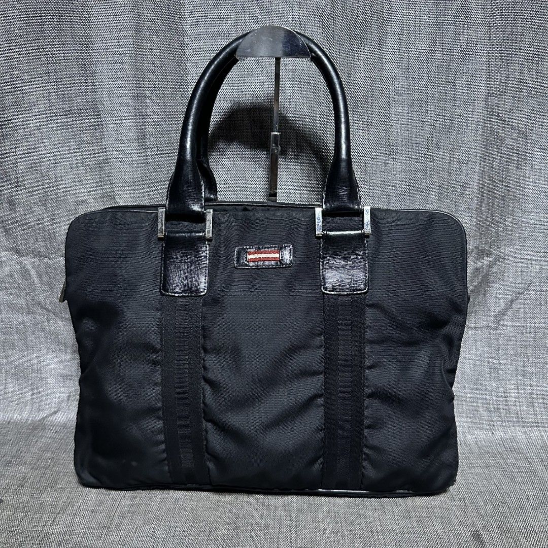Bally document bag (Category: Luxury Bags & Wallets) located in Manila. Submitted by greyinfash06839 (Listing ID 1360710247, Image 1). Description: 🤍Price: 12,900 pesos only 🤍Item: Bally document bag 🤍Brand: Bally 🤍Matirial: Nylon 🤍Quality: Original 🤍color: Black 🤍Size: Large 🤍Dimension. H: 12 L: 16 W: 4 🤍Sex: For Men 🤍Issue: Sign of use 🤍Condition Rate: 9/10 🤍Other info:.