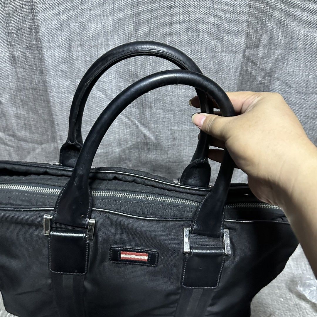 Bally document bag (Category: Luxury Bags & Wallets) located in Manila. Submitted by greyinfash06839 (Listing ID 1360710247, Image 3). Description: 🤍Price: 12,900 pesos only 🤍Item: Bally document bag 🤍Brand: Bally 🤍Matirial: Nylon 🤍Quality: Original 🤍color: Black 🤍Size: Large 🤍Dimension. H: 12 L: 16 W: 4 🤍Sex: For Men 🤍Issue: Sign of use 🤍Condition Rate: 9/10 🤍Other info:.