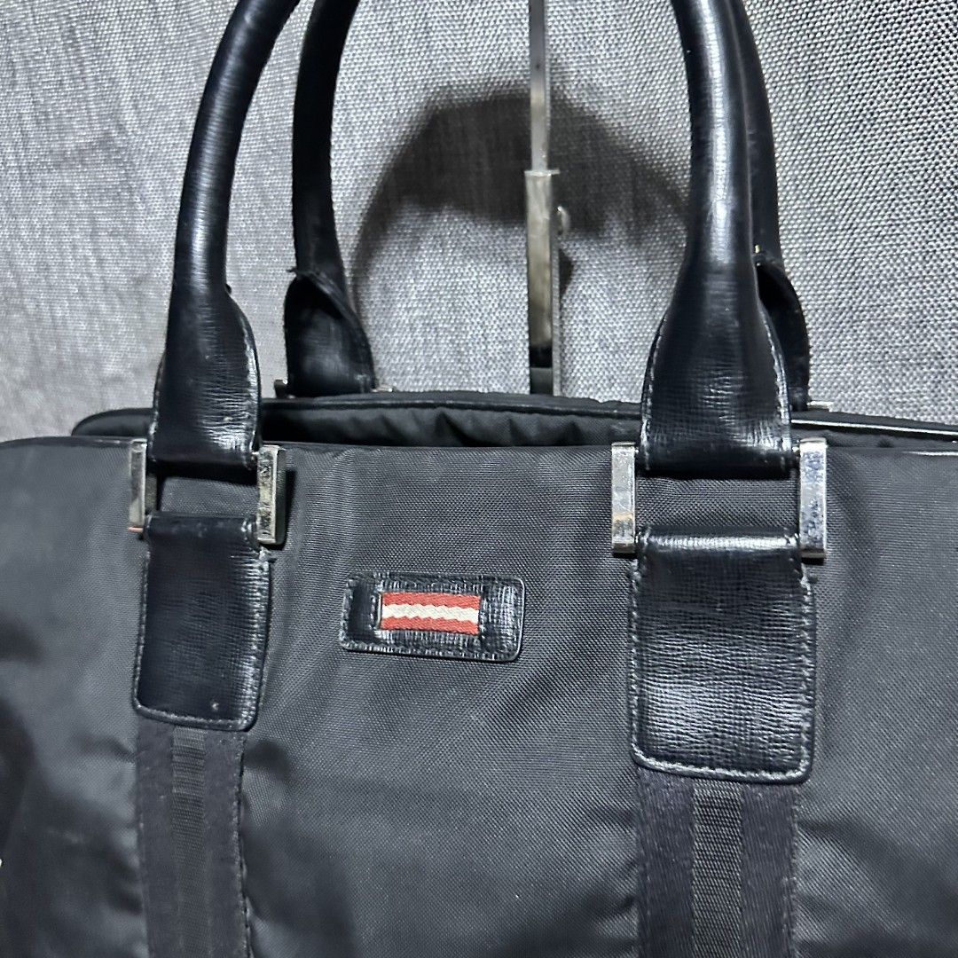 Bally document bag (Category: Luxury Bags & Wallets) located in Manila. Submitted by greyinfash06839 (Listing ID 1360710247, Image 2). Description: 🤍Price: 12,900 pesos only 🤍Item: Bally document bag 🤍Brand: Bally 🤍Matirial: Nylon 🤍Quality: Original 🤍color: Black 🤍Size: Large 🤍Dimension. H: 12 L: 16 W: 4 🤍Sex: For Men 🤍Issue: Sign of use 🤍Condition Rate: 9/10 🤍Other info:.
