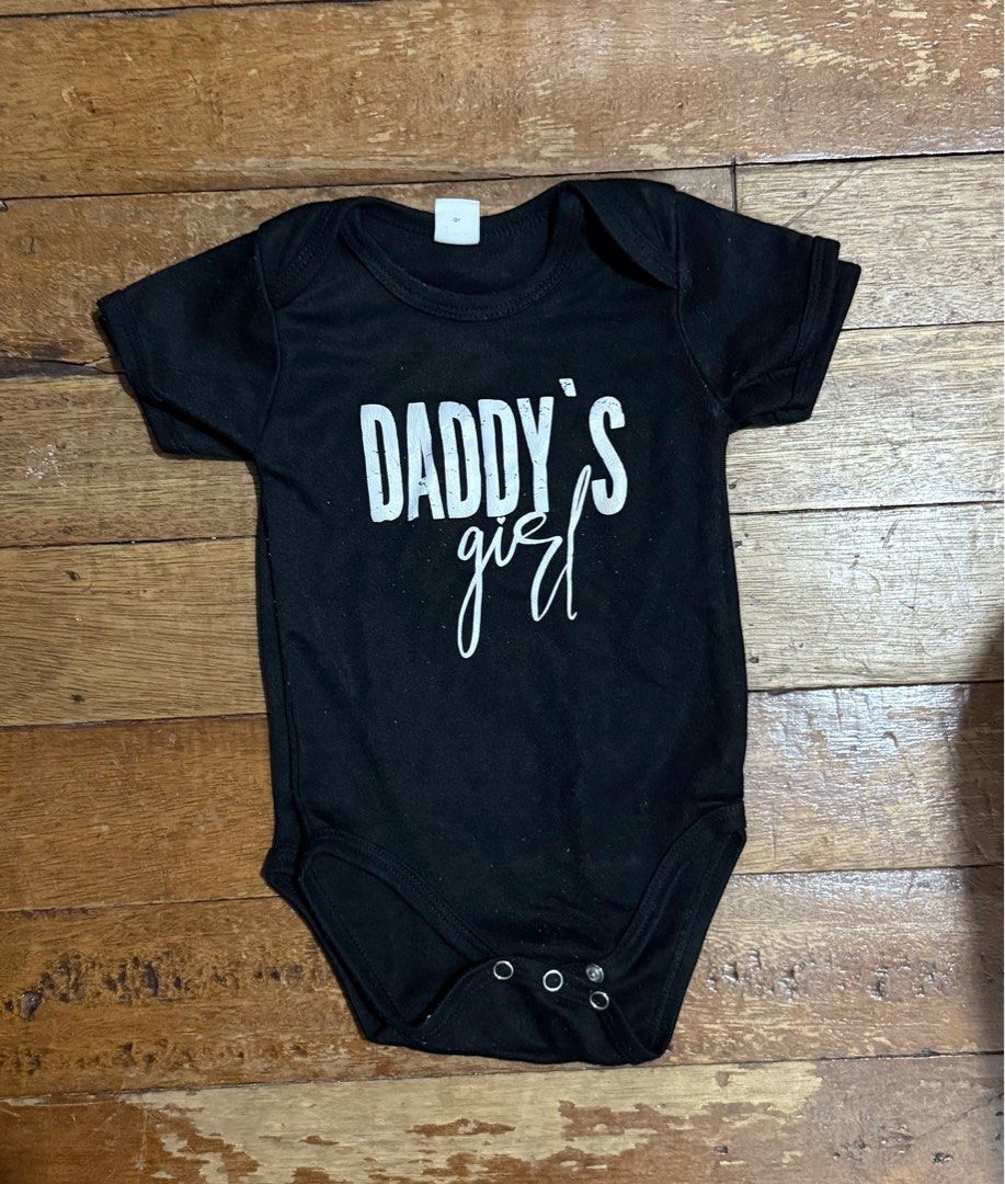 Daddy’s Girl Onesie (Category: Babies & Kids Fashion) located in Quezon City. Submitted by chi_declutters (Listing ID 1360682556, Image 2). Description: Size: 74 6-9mons Color black .