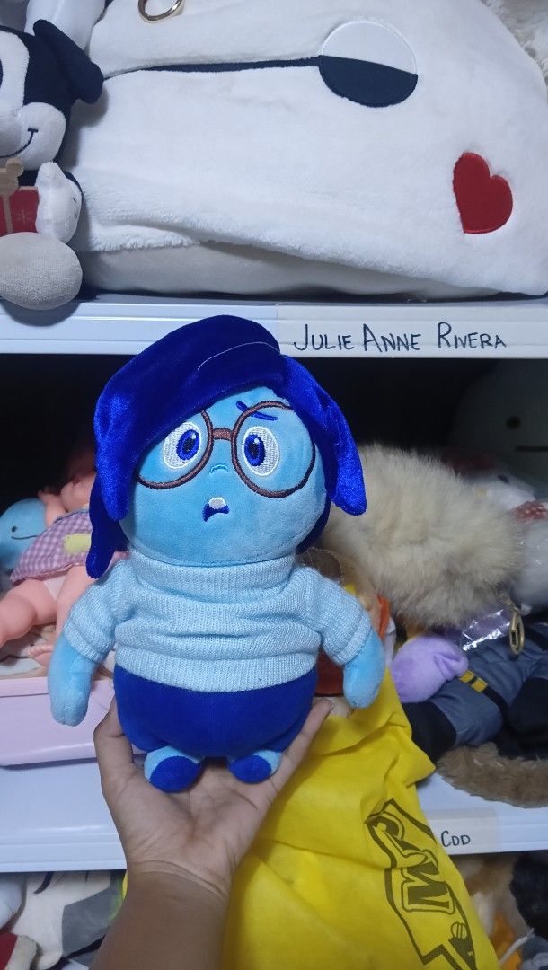DISNEY PIXAR Inside Out Sadness plush (Category: Plushies & Soft Toys) located in Manila. Submitted by annetrends_1998 (Listing ID 1360653444, Image 1). Description: what you see what you get Eteketa slightly faded mine now pay now j&t / flash no rush to ship visit my main FB account Julie Anne Rivera ( wearing blue cap).