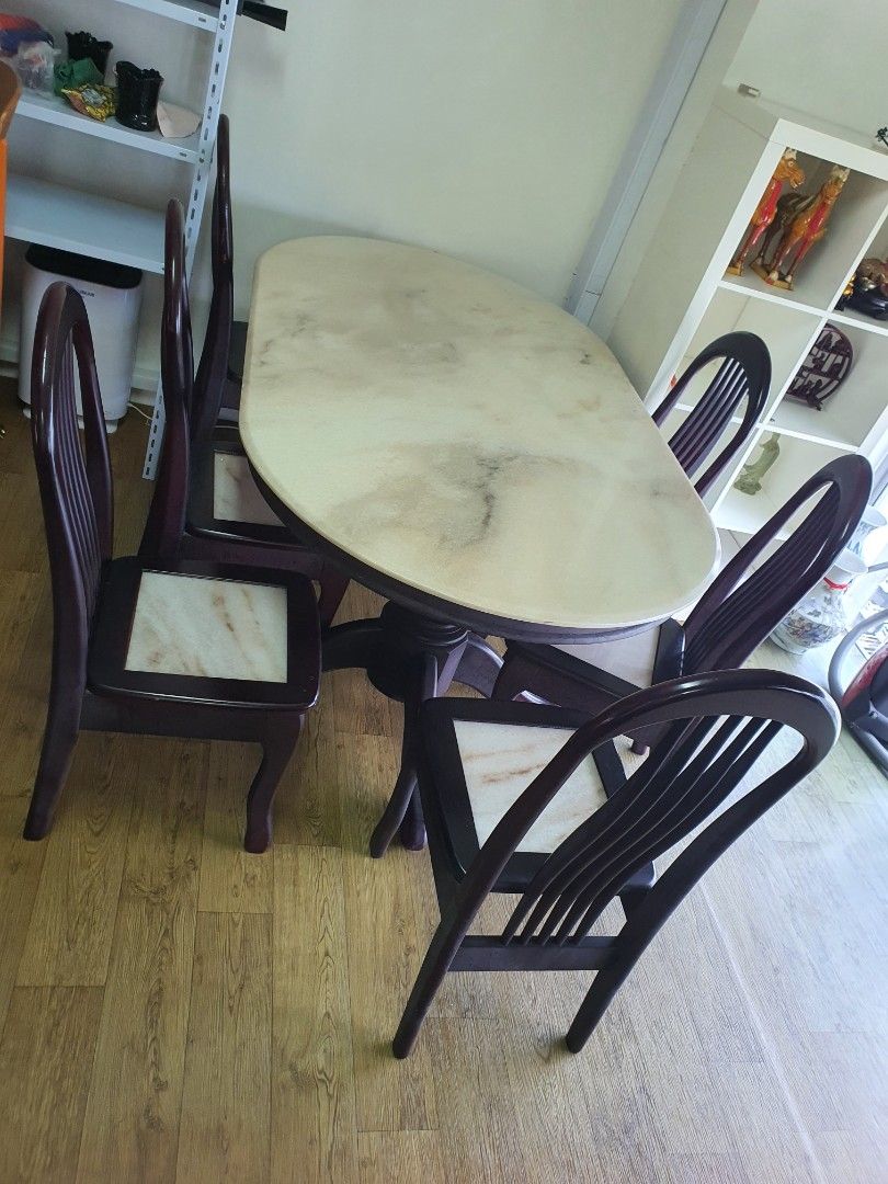 Marble table (Category: Tables & Sets) located in Singapore. Submitted by ahl12 (Listing ID 1360614929, Image 3). Description: Beautiful antique oval marble table with rosewood fitting, including 6 chairs with marble seats. Lots of character. Table: 1.8m length x 1.6m width x 0.7m height. Chair: Seat: 40cm x 40cm x Height 44cm. Self-dismantle, collection and transportation from Yishun North point Bizhub..