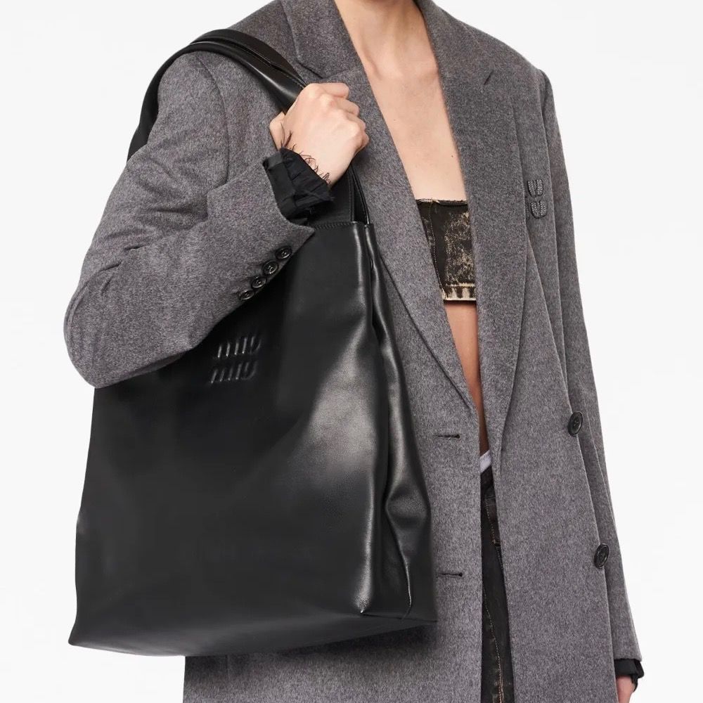 Miu Miu Logo embossed Black Hobo Bag (Category: Luxury Bags & Wallets) located in Antipolo. Submitted by chanchimj (Listing ID 1360664240, Image 1). Description: .