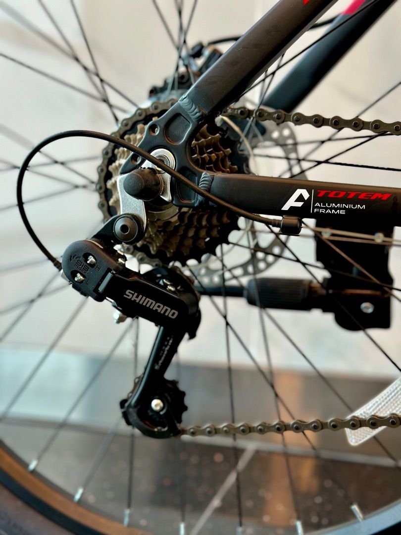 TOTEM Starlight 26" Mountain Bike | 21-speed Shimano Tourney (Category: Bicycles) located in Singapore. Submitted by bike_station (Listing ID 1360658634, Image 2). Description: TOTEM Starlight 26" Mountain Bike | 21-speed Shimano Tourney [ABOUT THE BIKE] Frame: Aluminium Alloy Fork: Suspension Fork Shifter: Shimano Tourney Front Derailleur: Shimano TZ500 Rear Derailleur: Shimano TY21 Brakes: Hydraulic Disc Brakes Chainwheel: Prowheel Wheelset: Al