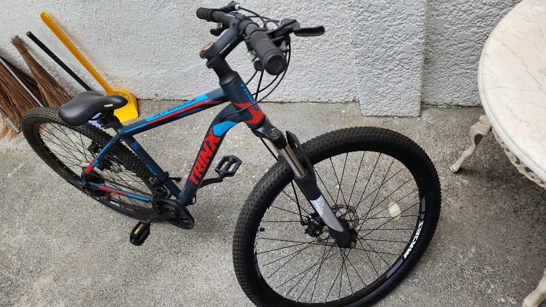 Trinx M100 27.5 Mountain Bike (Category: Bicycles) located in Quezon City. Submitted by kinsenas (Listing ID 1360646733, Image 2). Description: Trinx m100 27.5 4000 bought 8800 all stock Once nagamit noong pandemic tapos tinago na sa bodega May mga kalawang na because of non-use, stuck yung shifter I dont know kung ano ang solution hindi ako maalam masyado sa bike San Bartolome Q.C. area Pwede ipalalamove or pwede din puntahan dito sa amin. .