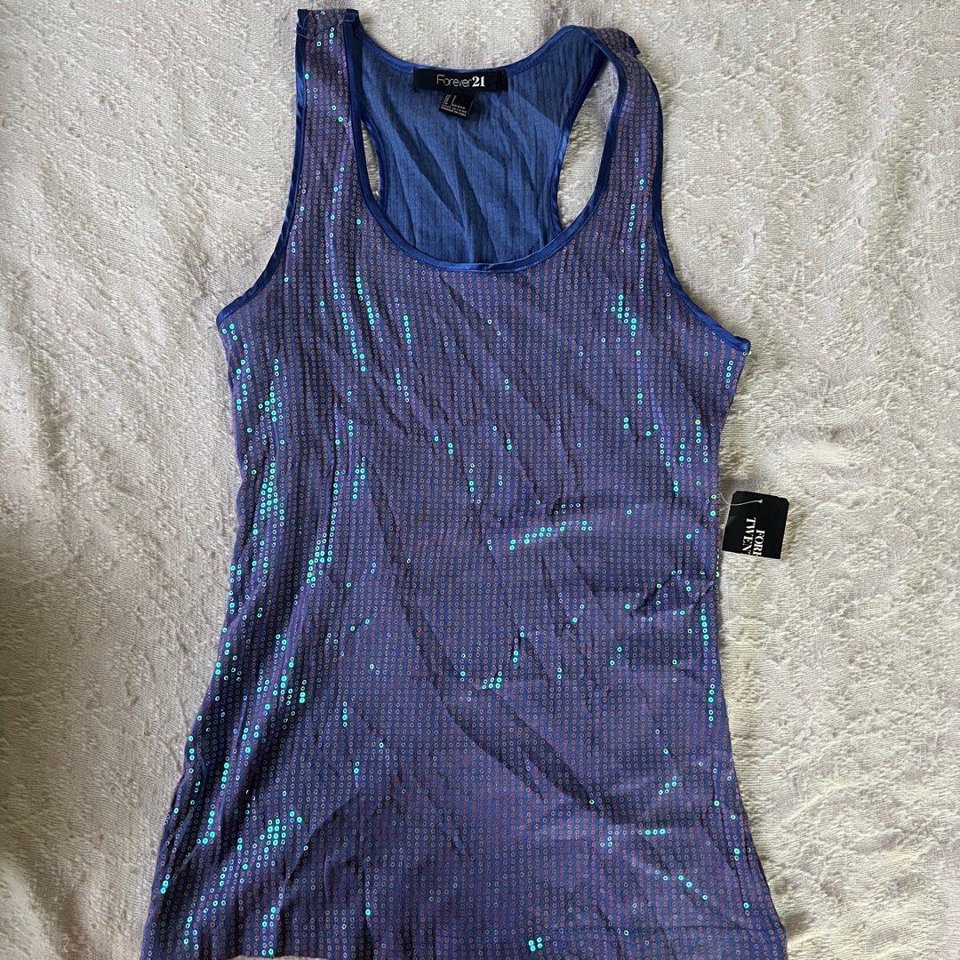 Forever 21 Blue Sequin Glitter Sleeveless Top (Category: Sleeveless) located in Rizal. Submitted by movingonsale.ph (Listing ID 1360861959, Image 1). Description: Fits s to m No when worn Shipping from Pioneer Mandaluyong.