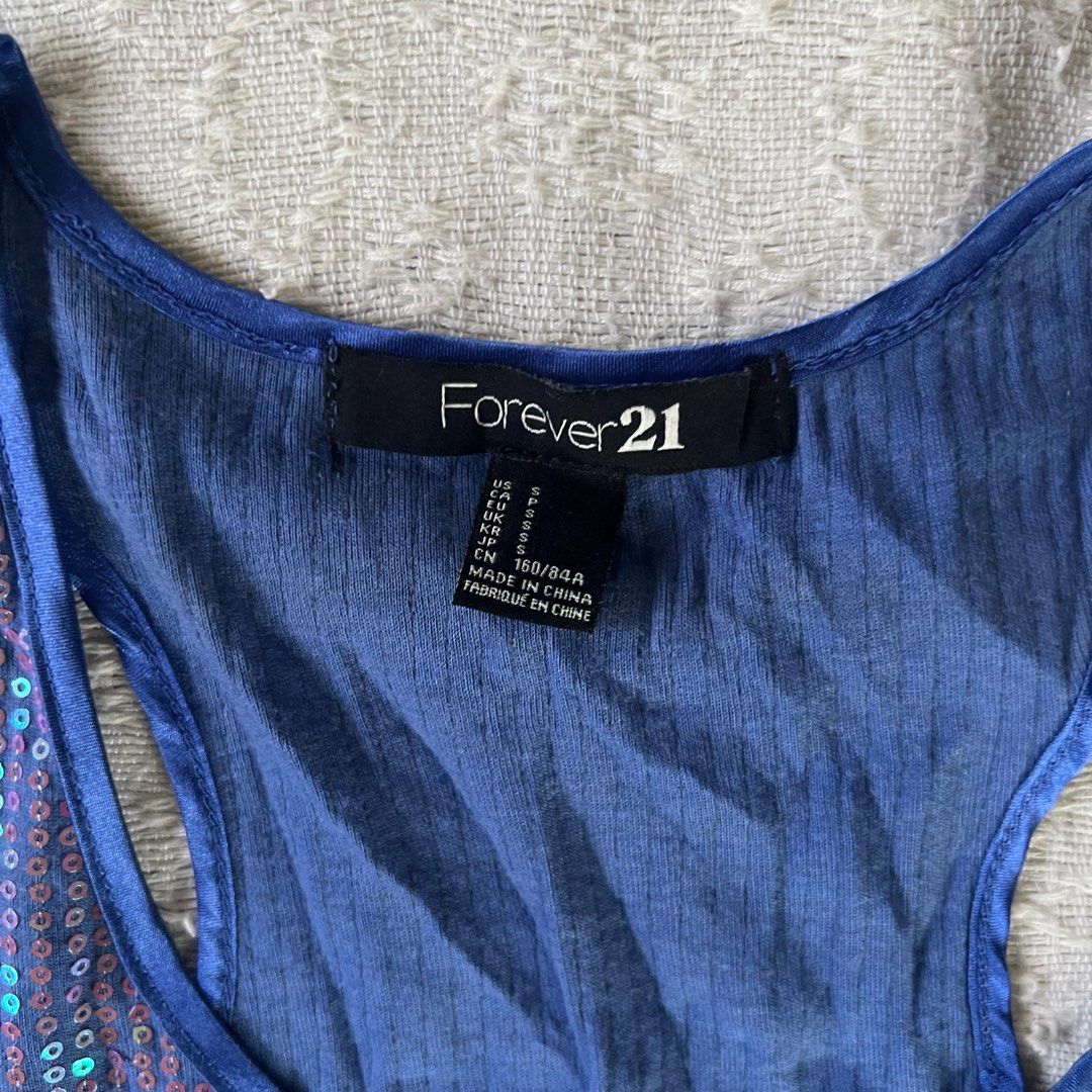 Forever 21 Blue Sequin Glitter Sleeveless Top (Category: Sleeveless) located in Rizal. Submitted by movingonsale.ph (Listing ID 1360861959, Image 2). Description: Fits s to m No when worn Shipping from Pioneer Mandaluyong.