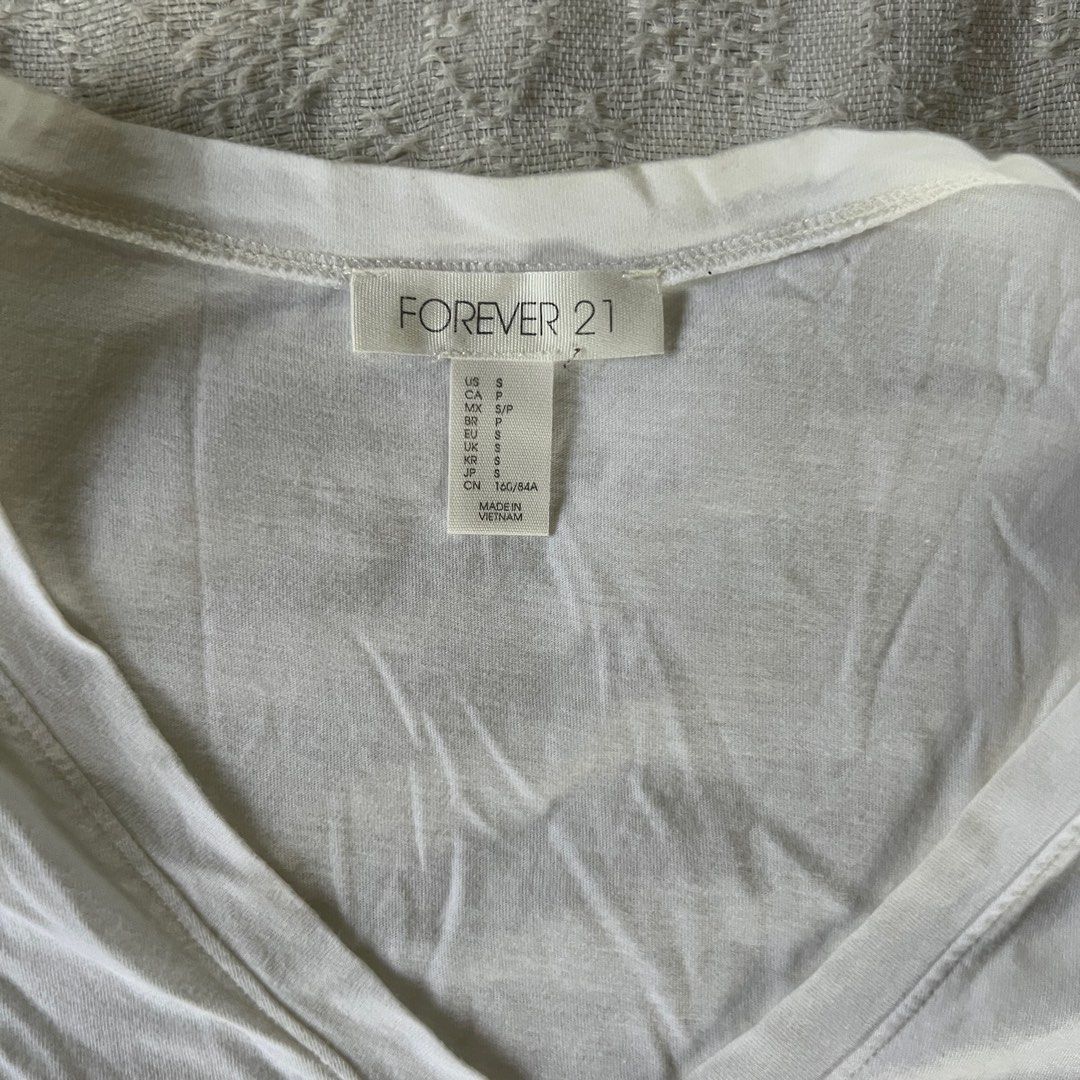 Forever 21 White V Neck Shirt (Category: Shirts) located in Rizal. Submitted by movingonsale.ph (Listing ID 1360862343, Image 2). Description: Fits xs to m No when worn Shipping from Pioneer Mandaluyong.
