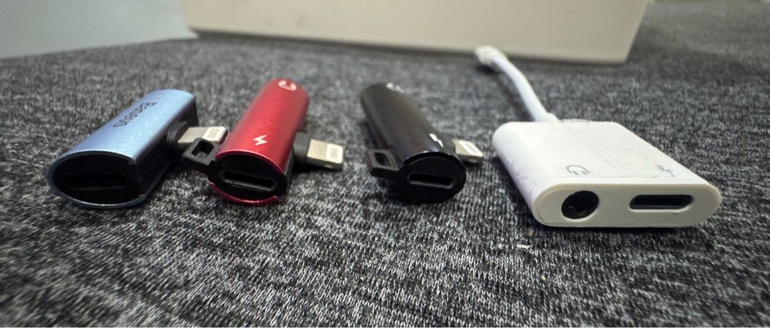 Jack Earphone Adapter (Category: Other Audio Equipment) located in Taguig. Submitted by erczzone (Listing ID 1360848538, Image 3). Description: Jack Headphone Adapter Calls and Music 2 in 1 charging 1. Baseus: Lightning to Lightning 2. Black and Red: Lightning to 3.5 mm AUX Audio Adapter 3. White: Lightning to 3.5 mm AUX Audio Adapter 100 each.