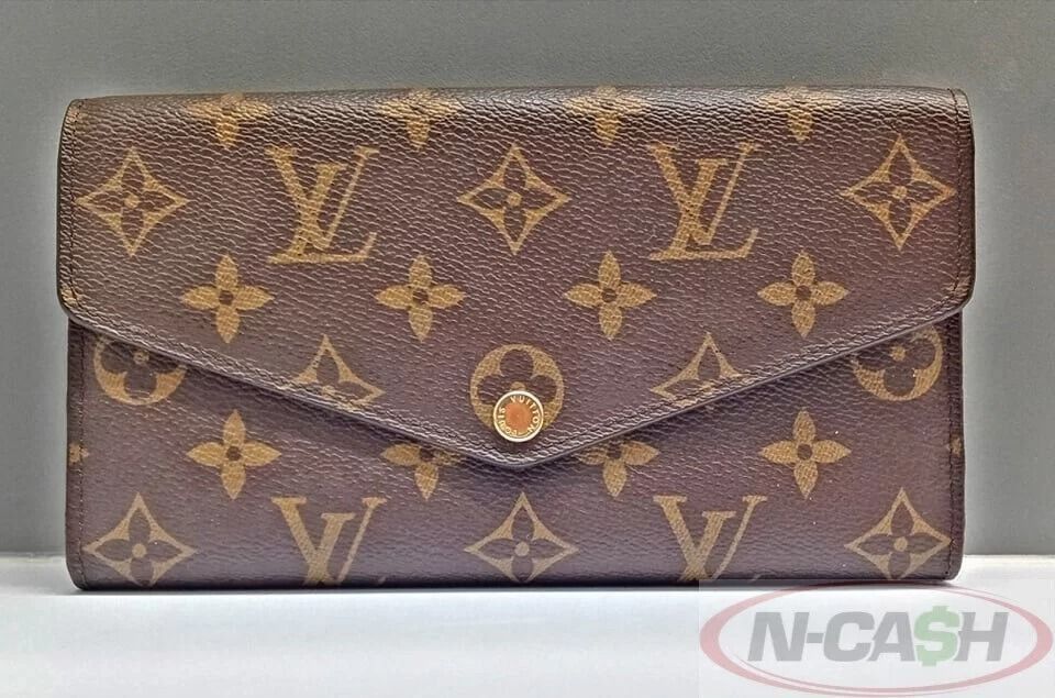 Louis Vuitton Sarah Monogram Canvas Envelope Wallet (Category: Luxury Bags & Wallets) located in Makati City. Submitted by luxury_by_ncash_2 (Listing ID 1360762724, Image 1). Description: N-Cash Pawnshop "Instant Cash for Bags, Watches, Cars, and Electronics" https://www.ncash-pawnshop-philippines.com/ Louis Vuitton Sarah Monogram Canvas Envelope Wallet Measures: 7.5″ L x 4.1″ H x 1″ D (approx) Material: Monogram Canvas Cross-Grain Leather Lining
