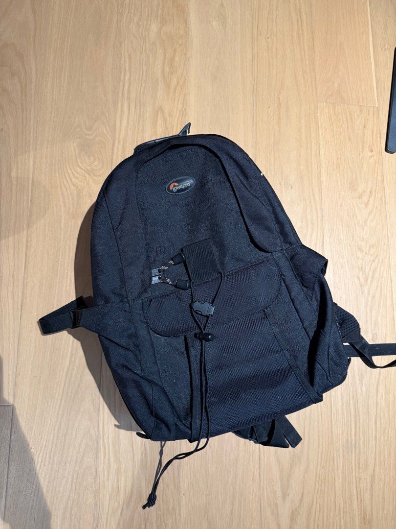 Lowepro camera backpack (Category: Backpacks) located in Singapore. Submitted by 123134l (Listing ID 1360733882, Image 1). Description: Used, small stain on the inner flap of the backpack, has a padded compartment for laptop as well .