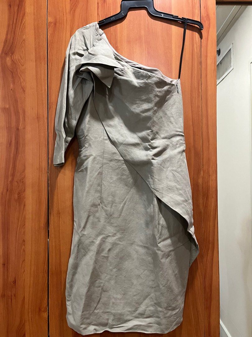 Tailored linen one shoulder dress (Category: Dresses) located in Makati City. Submitted by gapofa (Listing ID 1360857914, Image 1). Description: Super unique tailored piece by Thai designer. Linen grey fabric fully lined. Simple cut that can be dressed up with the right accessories for understated chic. Great for a wedding.