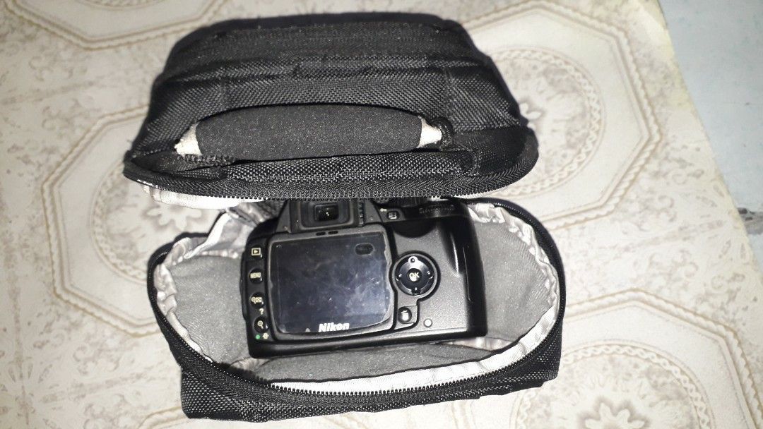 Toploader Camera Bag (Category: Camera Bags & Carriers) located in Quezon City. Submitted by Mr._Vintageous (Listing ID 1360743247, Image 2). Description: Up for Sale! Toploader camera bag. Has 2 outer zippered pockets. Can be used with DSLR , Mirrorless or Film SLR camera bodies. Comes with shoulder strap. Sample camera body is Nikon D60 D60 with 50mm prime lens. Actual pictures posted. Meet up along SM Fairview. Shipping available at buyer's ex
