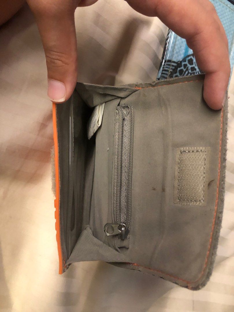 Wallets (Category: Wallets & Card Holders) located in Singapore. Submitted by lex447789 (Listing ID 1360806611, Image 9). Description: Black leather wallet with coin holder cash and card holder-15$ Light blue dark blue Cambodia recycled wallet with cash and card holder 15$ for both Orange cash card and coin holder-5 .