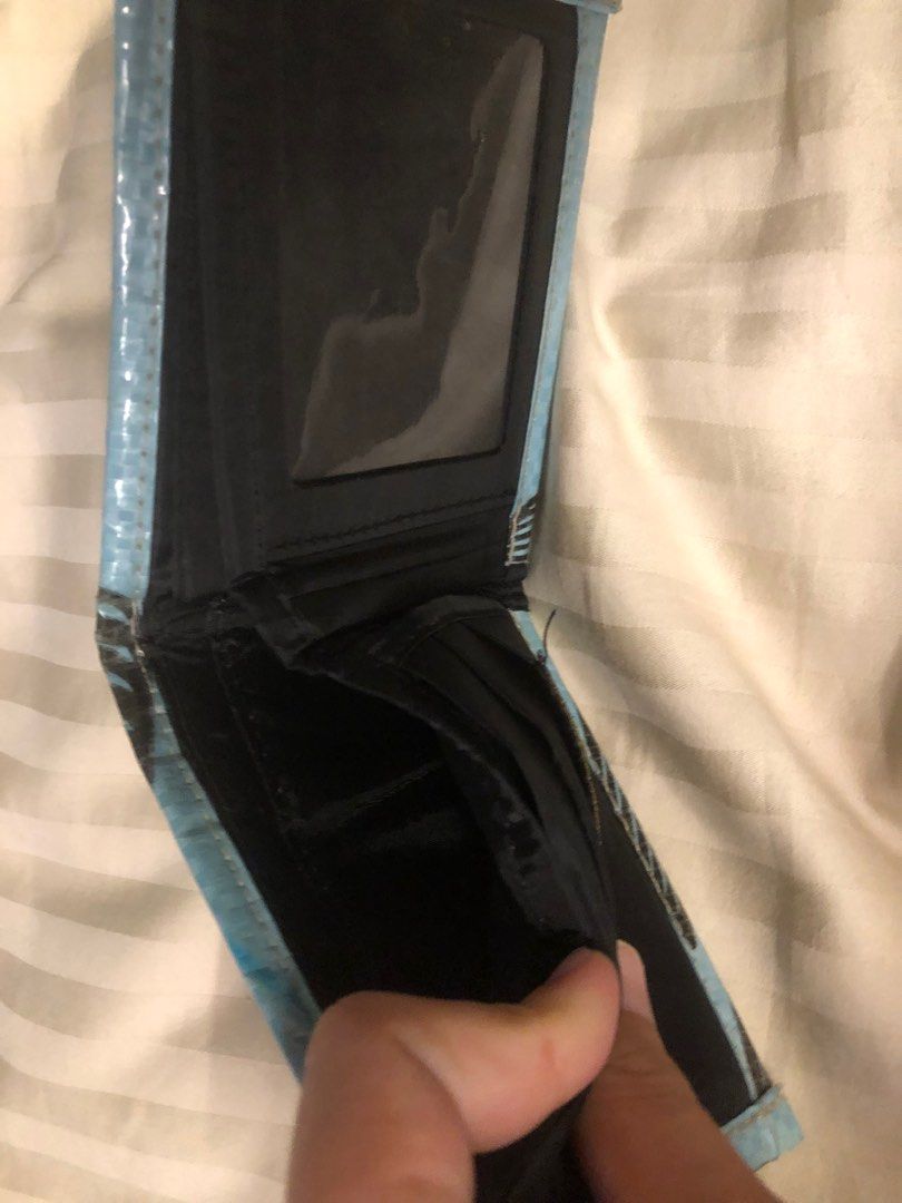 Wallets (Category: Wallets & Card Holders) located in Singapore. Submitted by lex447789 (Listing ID 1360806611, Image 8). Description: Black leather wallet with coin holder cash and card holder-15$ Light blue dark blue Cambodia recycled wallet with cash and card holder 15$ for both Orange cash card and coin holder-5 .