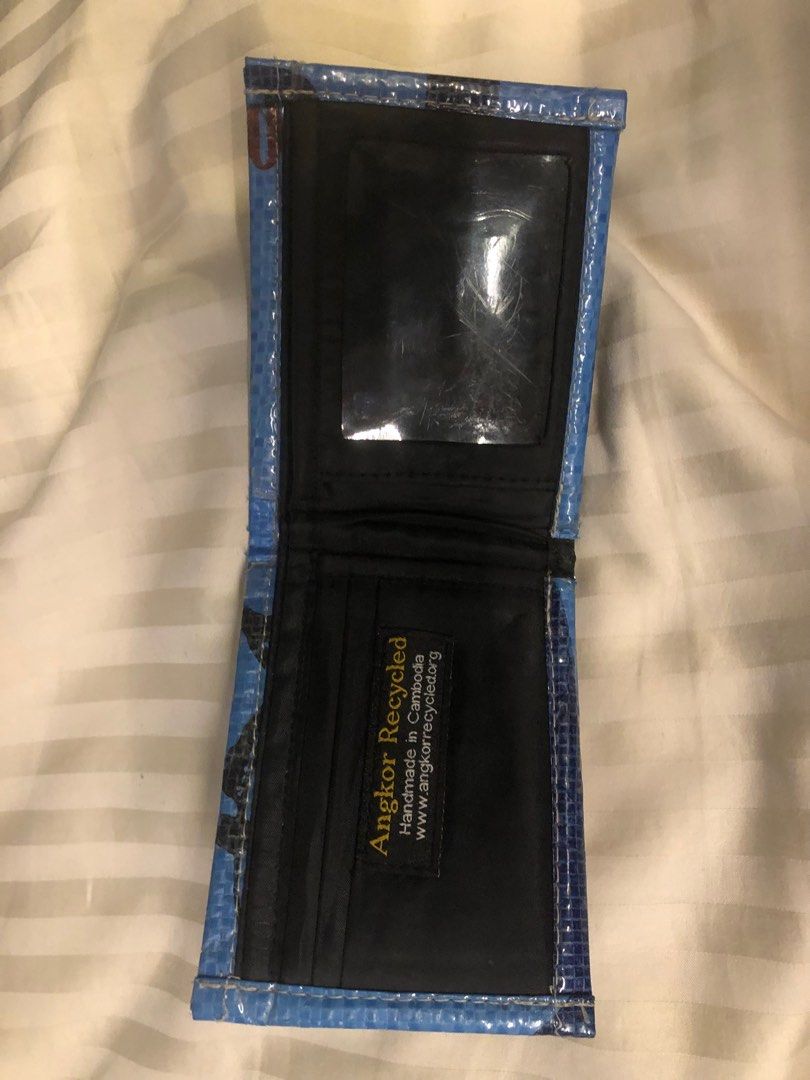 Wallets (Category: Wallets & Card Holders) located in Singapore. Submitted by lex447789 (Listing ID 1360806611, Image 5). Description: Black leather wallet with coin holder cash and card holder-15$ Light blue dark blue Cambodia recycled wallet with cash and card holder 15$ for both Orange cash card and coin holder-5 .