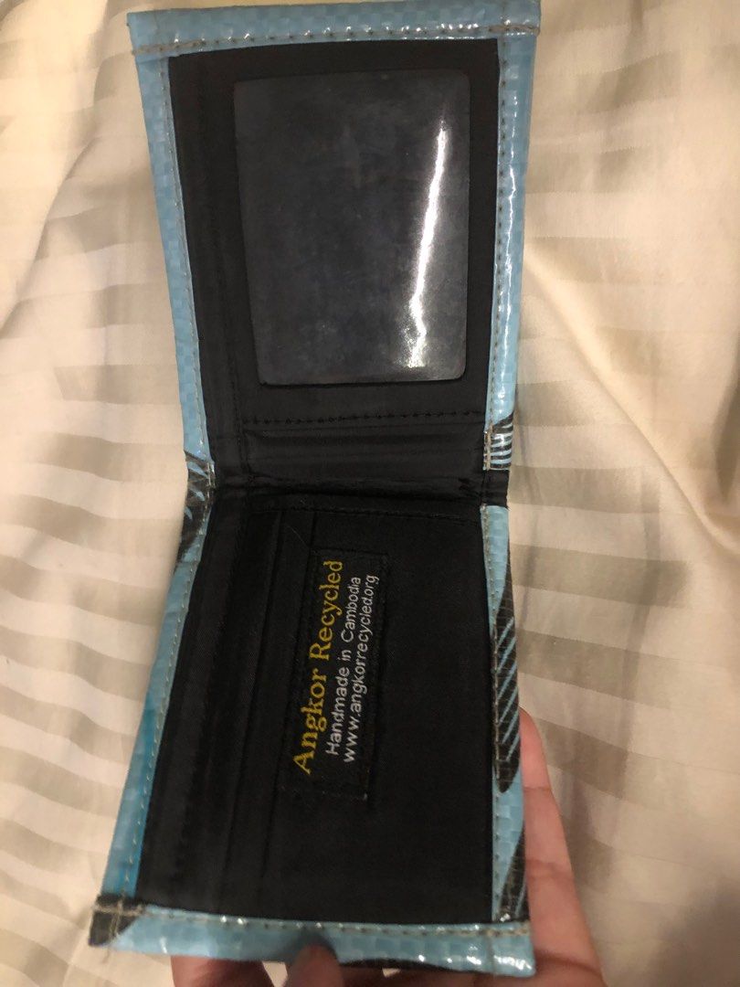 Wallets (Category: Wallets & Card Holders) located in Singapore. Submitted by lex447789 (Listing ID 1360806611, Image 7). Description: Black leather wallet with coin holder cash and card holder-15$ Light blue dark blue Cambodia recycled wallet with cash and card holder 15$ for both Orange cash card and coin holder-5 .