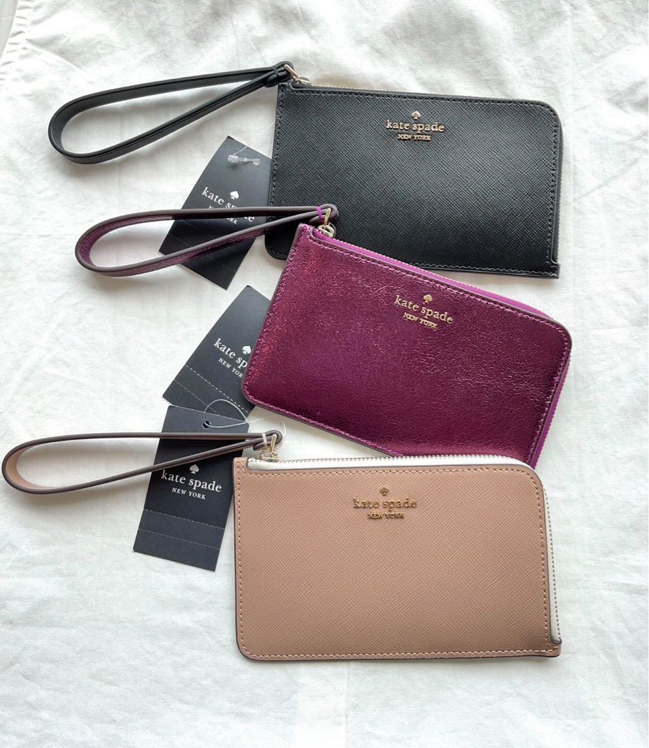 Authentic Kate spade small L-zip wristlet (Category: Wallets & Card holders) located in Taytay. Submitted by delutterproject (Listing ID 1360900054, Image 3). Description: Brand new Authentic Kate Spade small L-zip wristlet - ₱3,000 only -metallic dark raspberry -Black -Bi color hazelnut ⚫️Onhand; Ready to ship (Lalamove/J&T express) Guaranteed authentic from US.