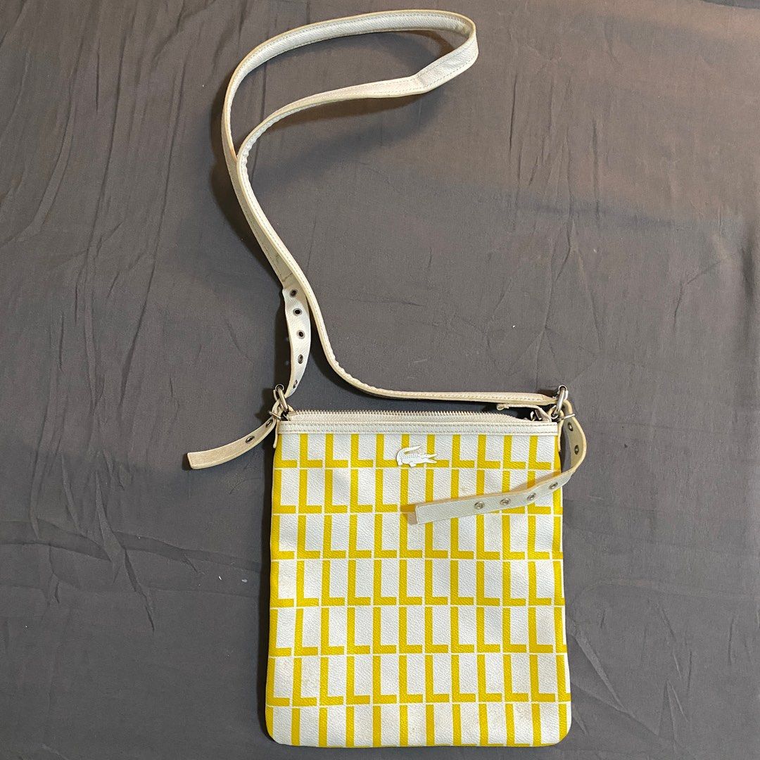 Yellow and White Lacoste Slingbag (Category: Cross-body Bags) located in Rizal. Submitted by TheRetailAddict (Listing ID 1360994125, Image 1). Description: •Never been used •Has one inner compartment.