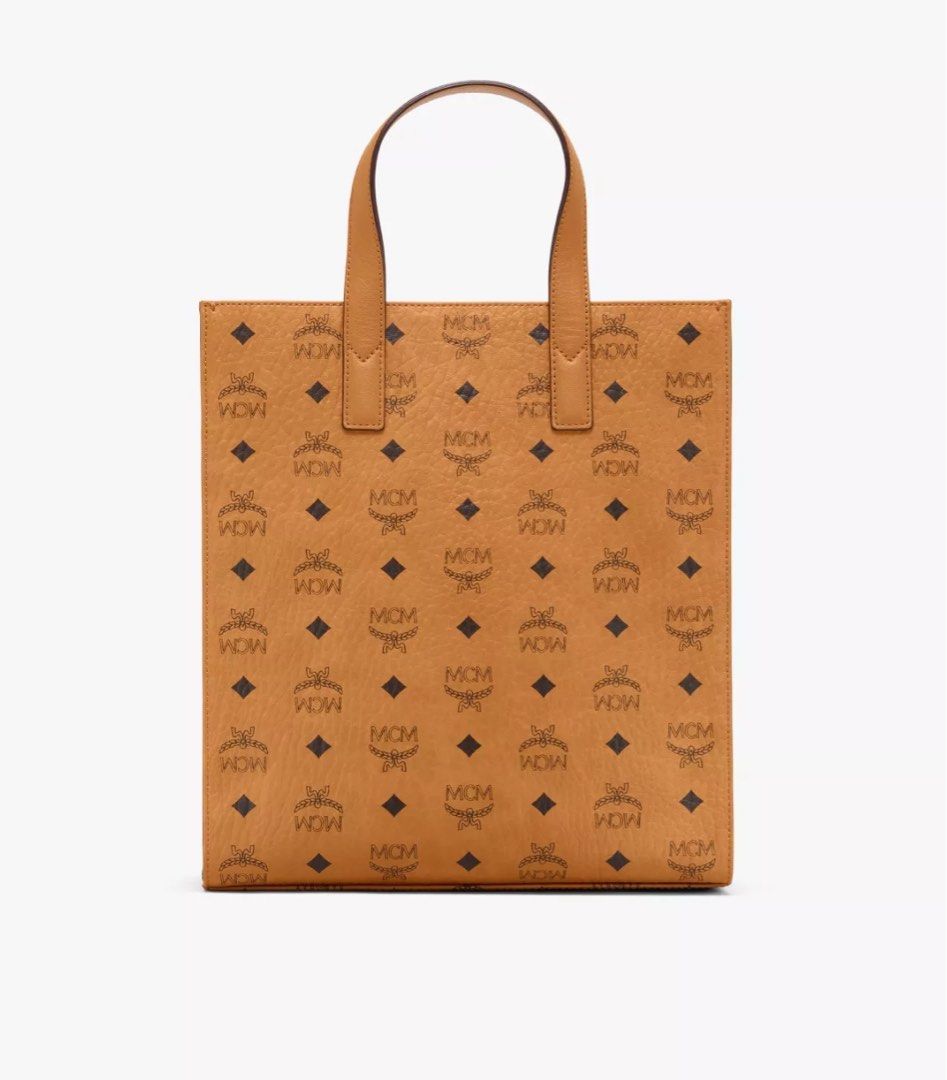 MCM KLASSIK TOTE AREN (Category: Bags & Wallets) located in Singapore. Submitted by uknees.yxh (Listing ID 1356193733, Image 3). Description: KLASSIK TOTE IN VISETOS COGNAG Size: Small Condition: Lightly used. Minor flaws. DM for more photos and clearer pictures. Receipt available. Comes with shoulder strap. Bought in 2021 and rarely used it. Currently selling as AREN TOTE on MCM. .