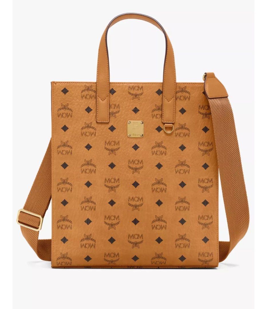 MCM KLASSIK TOTE AREN (Category: Bags & Wallets) located in Singapore. Submitted by uknees.yxh (Listing ID 1356193733, Image 1). Description: KLASSIK TOTE IN VISETOS COGNAG Size: Small Condition: Lightly used. Minor flaws. DM for more photos and clearer pictures. Receipt available. Comes with shoulder strap. Bought in 2021 and rarely used it. Currently selling as AREN TOTE on MCM. .