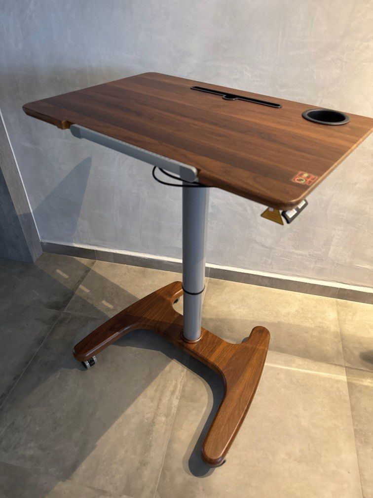 Movable Computer/Study Table (Category: Tables & Sets) located in Singapore. Submitted by knitez (Listing ID 1356142216, Image 2). Description: Movable computer/study table that is adjustable in height and angle. Table top measures 72cm x 48cm. Rarely used hence excellent condition. .