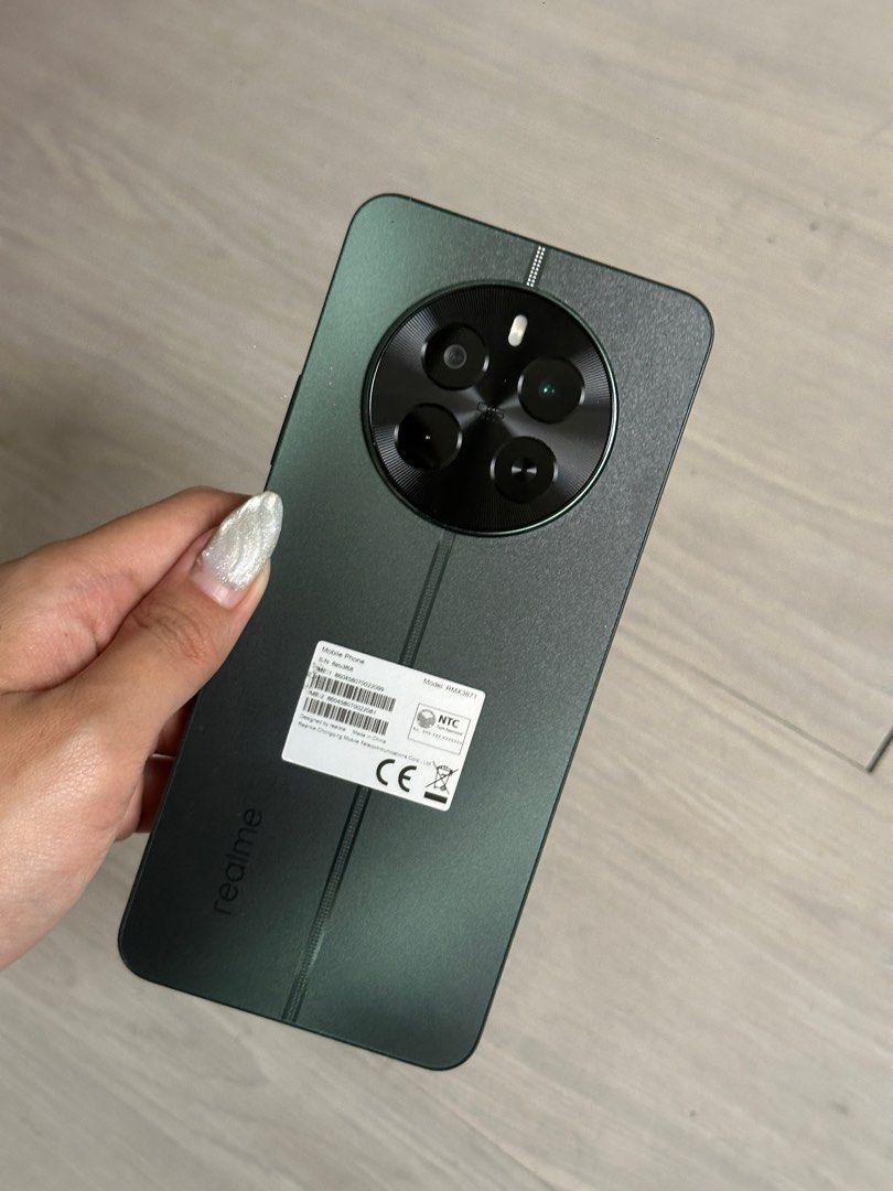 realme 12 (Category: Realme) located in Mandaluyong City. Submitted by lilmisscapricorn (Listing ID 1356236763, Image 1). Description: almost new! used only for photos original price: Php 16,000 selling price: Php 9,999 realme 12 5G Smartphone | 8GB+256GB | MTK Dimensity 6100+ | 108MP Camera • Memory: 8GB+256GB • Processor: MediaTek Dimensity 6100+ • Display: 6.7’’ FHD+ 120Hz Sunlight Display • Rear Camera: 108MP + 2MP • Front Camera: 8MP • Batte