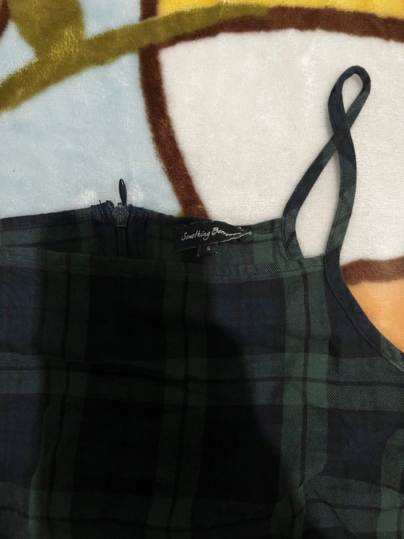 Something Borrowed Green Plaid Halter Dress (Category: Dresses) located in Baguio. Submitted by kaudry_ (Listing ID 1356234677, Image 2). Description: ✅size:S on tag can fit S-semi M ✅mini dress. Measurements in pics ✅a bit loose na bit still super nice RFS: decluttering .