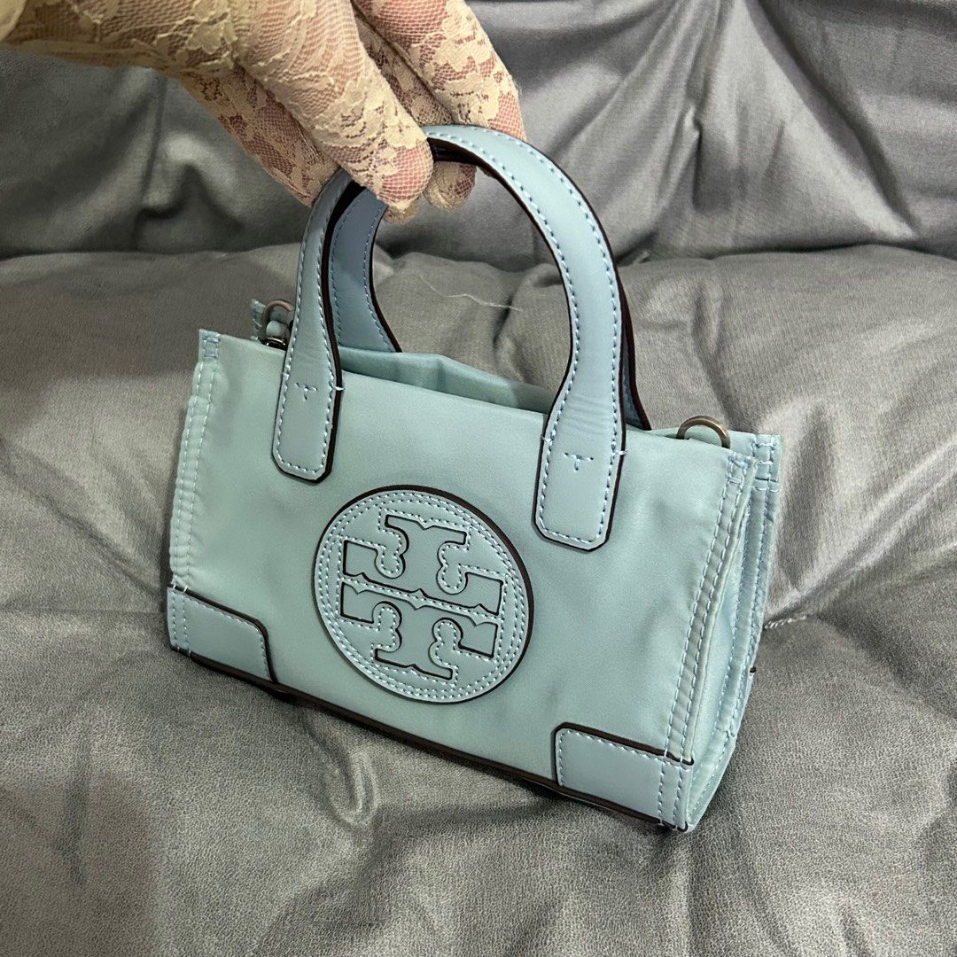 TB - Tory Burch Small Ella Tote (Category: Luxury Bags & Wallets) located in Quezon City. Submitted by luxurybyluci (Listing ID 1356231301, Image 2). Description: Tory Burch Ella Tote Nylon Material Complete with Inclusions Authentic On Hand Brandnew.