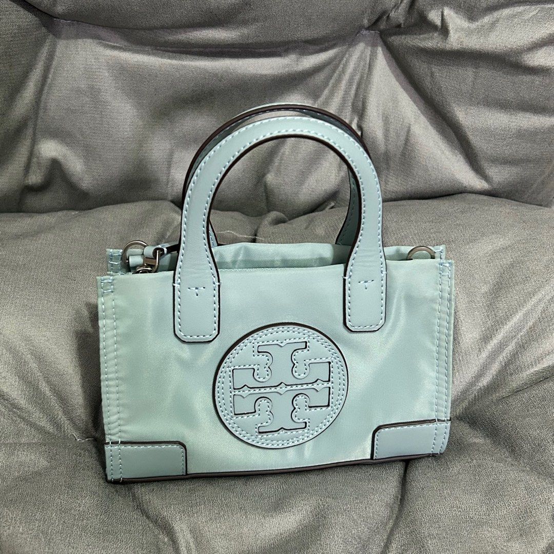 TB - Tory Burch Small Ella Tote (Category: Luxury Bags & Wallets) located in Quezon City. Submitted by luxurybyluci (Listing ID 1356231301, Image 1). Description: Tory Burch Ella Tote Nylon Material Complete with Inclusions Authentic On Hand Brandnew.