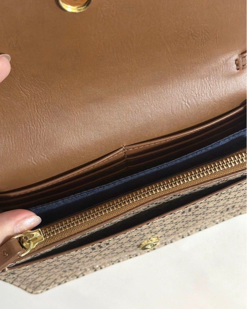 Tommy Hilfiger tan/brown chain sling bag (Category: Luxury Bags & Wallets) located in Makati City. Submitted by popmart (Listing ID 1356090176, Image 3). Description: Orig from US Unused, just stored With lots of compartments (check photos).