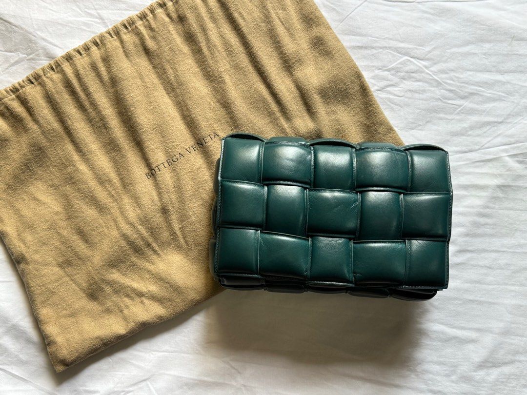 AUTHENTIC Bottega Veneta Padded Cassette (Category: Luxury Bags & Wallets) located in Tarlac. Submitted by cheapluxuryfinds (Listing ID 1361097968, Image 1). Description: • Padded Intreccio leather cross-body bag • Single interior zip pocket • Metal closure • Material: 100% Lambskin • Lining: Lambskin bonded Intreccio • Color: Black • Hardware: Silver finish • Height: 18 cm | 7.1" • Width: 26 cm | 10.2" • Depth: 8 cm | 3.15" • Strap drop: 50 cm |