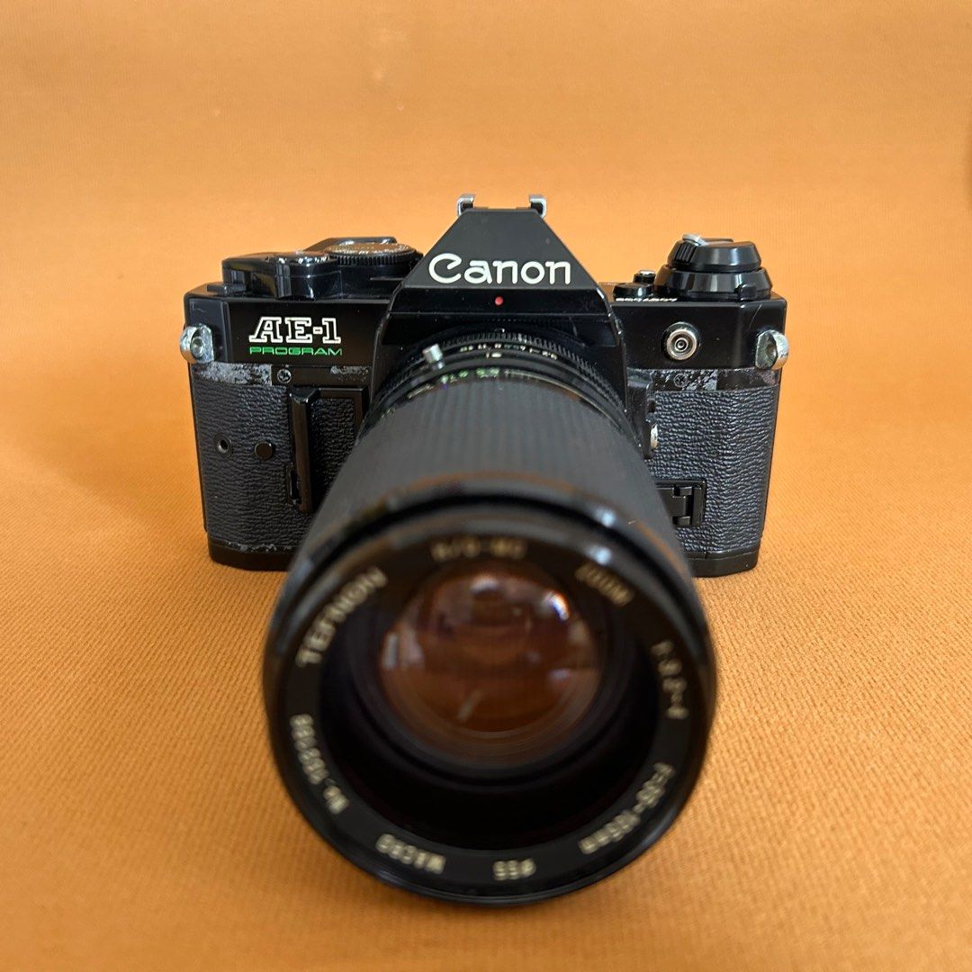 Canon AE-1 Program film camera slr (Category: Cameras) located in Manila. Submitted by pl4y_it_4g4in (Listing ID 1361073481, Image 1). Description: Used Issue: *minsan nag stuck yung mirror *rust and paint chip on body *lens fungus *pls check photos for cosmetic condition Tested on battery and dummy film only shutter ok Wind knob ok Rewind knob ok Film advance ok Film counter ok .