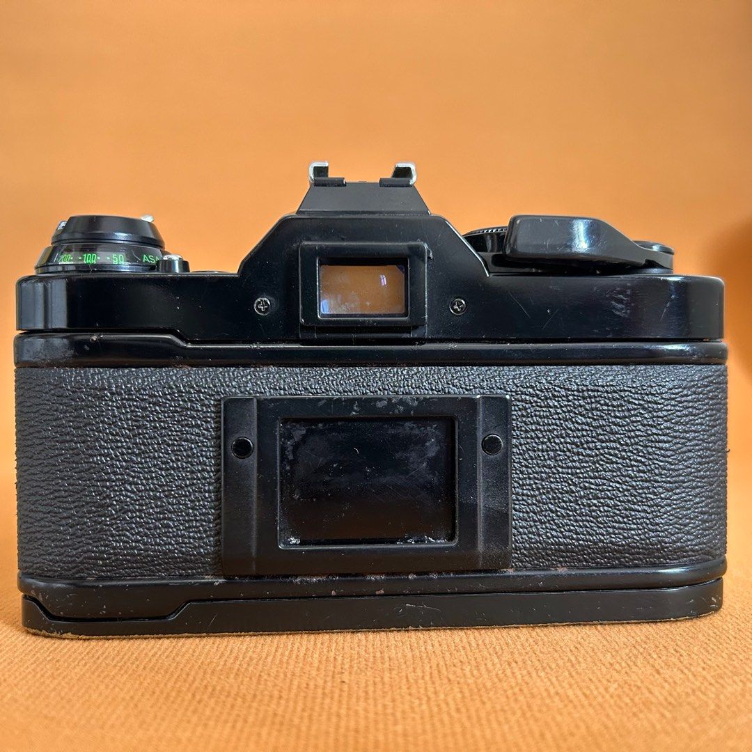 Canon AE-1 Program film camera slr (Category: Cameras) located in Manila. Submitted by pl4y_it_4g4in (Listing ID 1361073481, Image 2). Description: Used Issue: *minsan nag stuck yung mirror *rust and paint chip on body *lens fungus *pls check photos for cosmetic condition Tested on battery and dummy film only shutter ok Wind knob ok Rewind knob ok Film advance ok Film counter ok .