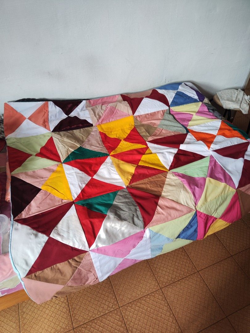 Handmade Patchwork Blanket (Category: Handmade Craft) located in Singapore. Submitted by devilegna0704 (Listing ID 1296239287, Image 7). Description: Handmade by grandma using a traditional sewing machine. Size as shown in photos (approx 155cm x 130cm) Blanket 1: pic 1 - 3 Blanket 2: pic 4-6 Blanket 3: pic 7-9.