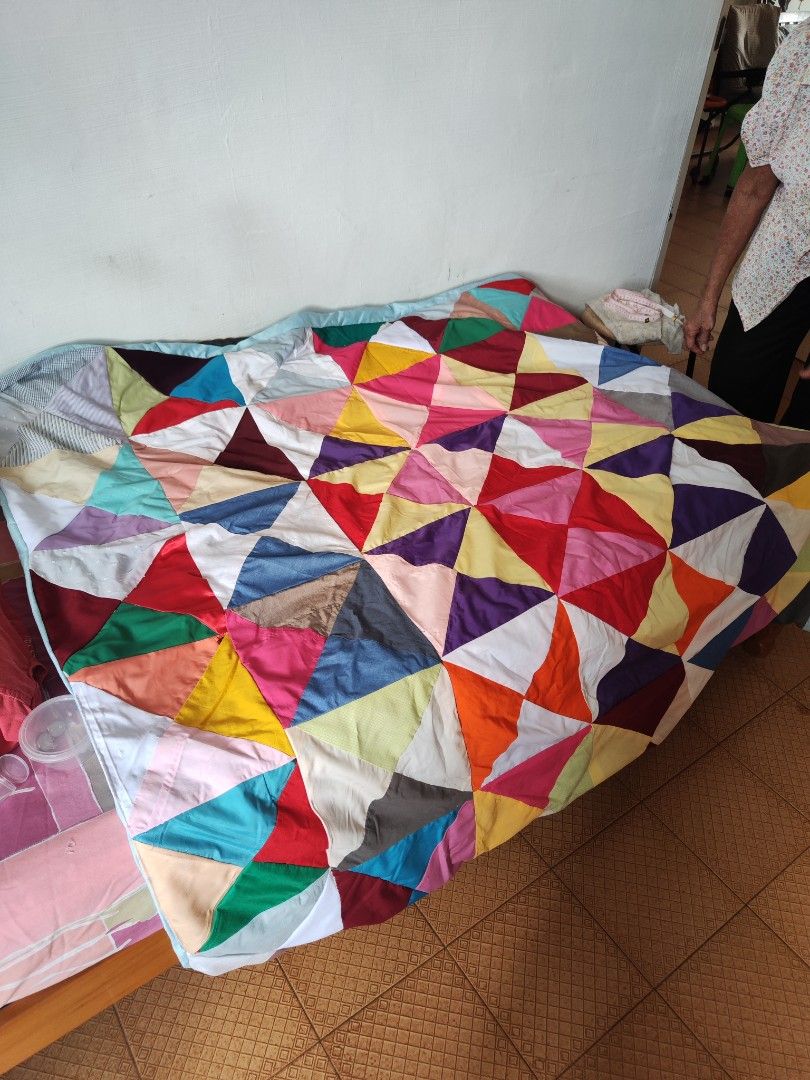 Handmade Patchwork Blanket (Category: Handmade Craft) located in Singapore. Submitted by devilegna0704 (Listing ID 1296239287, Image 4). Description: Handmade by grandma using a traditional sewing machine. Size as shown in photos (approx 155cm x 130cm) Blanket 1: pic 1 - 3 Blanket 2: pic 4-6 Blanket 3: pic 7-9.
