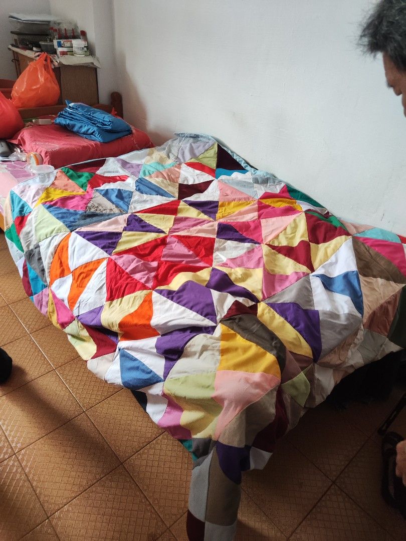 Handmade Patchwork Blanket (Category: Handmade Craft) located in Singapore. Submitted by devilegna0704 (Listing ID 1296239287, Image 5). Description: Handmade by grandma using a traditional sewing machine. Size as shown in photos (approx 155cm x 130cm) Blanket 1: pic 1 - 3 Blanket 2: pic 4-6 Blanket 3: pic 7-9.