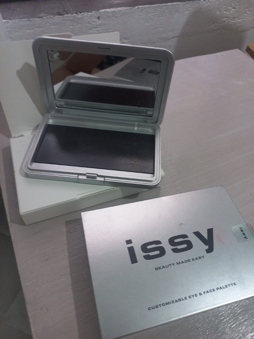 ISSY Regular Pallete with FREE EYESHADOW INSERTS (Category: Makeup) located in Valenzuela. Submitted by laizhanz_07 (Listing ID 1361059550, Image 1). Description: -Original Issy Pallete (may crack, pero nilagyan ng glue) -Walang box -Free eyeshadow inserts from different brands: squad co squadlet serene (repan) -In good condition -Eyeshadows are used from swatches only -Payment first via Gcash -Buyer should shoulder the shipping fee -Negotiable.