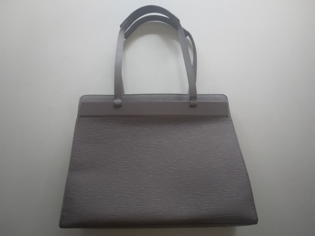 Louie Vuitton Croisette Authentic (Category: Luxury Bags & Wallets) located in Taguig. Submitted by pavarotti (Listing ID 1361067738, Image 3). Description: Barely used. 100% authentic Louie Vuitton Croisette bag in lilac epi leather. 2 open pockets outside. Mobile phone and open pocket inside. Hard to find rare discontinued bag. Size 15x12.2x4.7 inches. No box/dust bag..