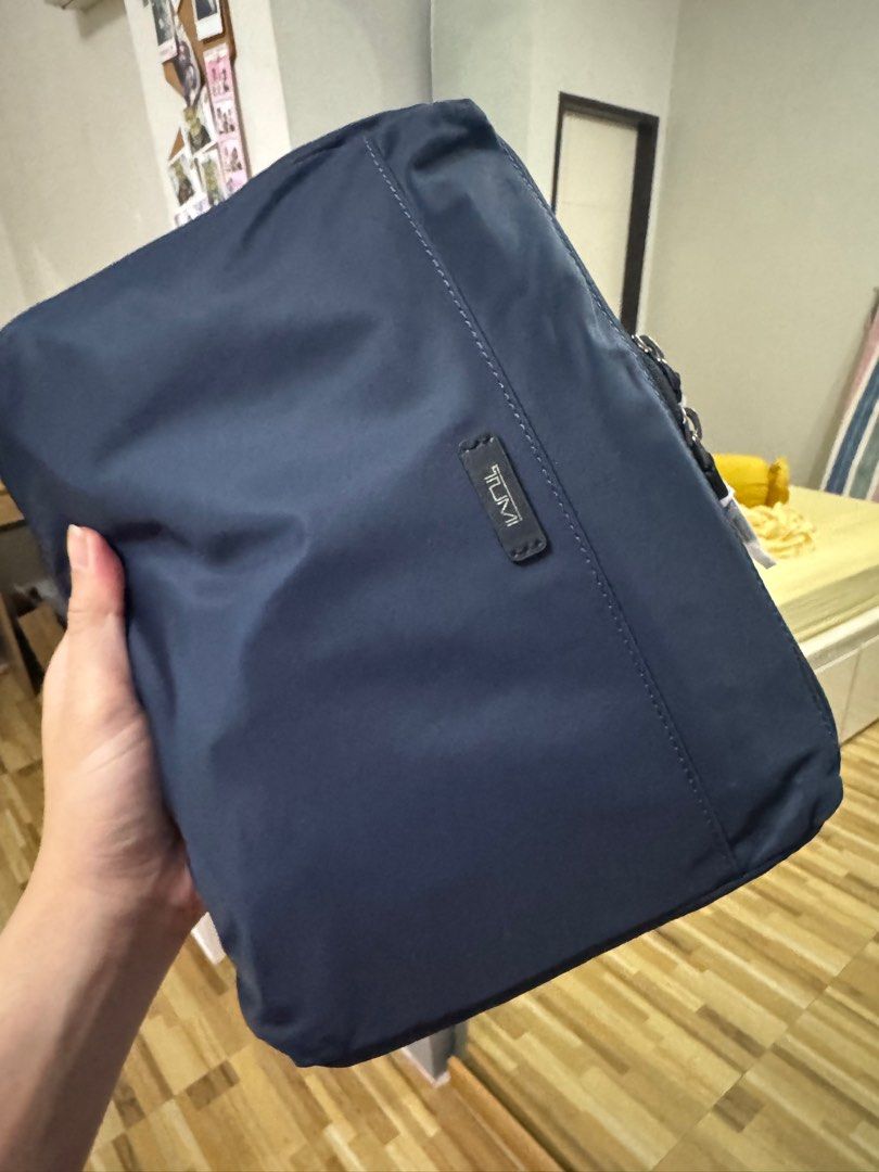 Tumi Packable Backpack (Category: Luxury Bags & Wallets) located in Quezon City. Submitted by fayeruuh (Listing ID 1361120390, Image 2). Description: Tumi Packable Backpack Navy Blue 98% Nylon Perfect for traveling as an extra bag Opened once just to check product. Then just stored after. Last photo is just for reference. Can open it if you ask for more photos. RFS: Have the packable duffel bag, decluterring.