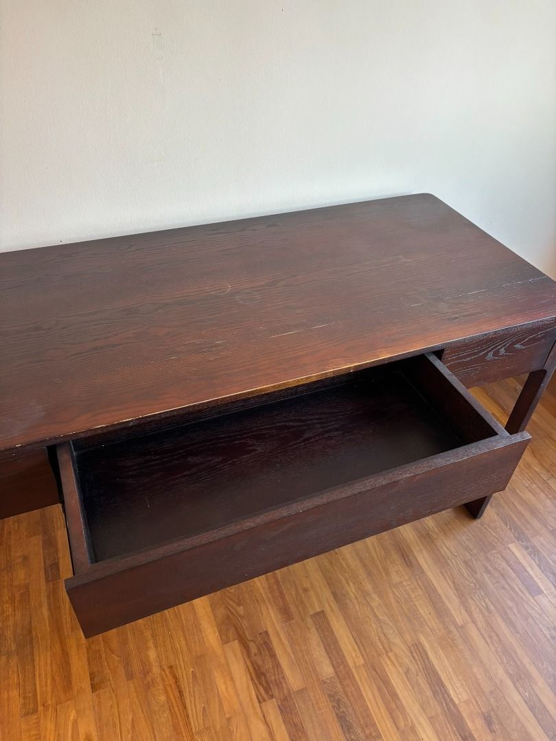 Walnut study table (Category: Tables & Sets) located in Singapore. Submitted by fossiled_freak (Listing ID 1361170152, Image 2). Description: Preloved study table made of sturdy wood Comes with spacious drawer Has signs of wear (water marks and scratches) Length 145cm Depth 50cm Height 75cm Viewing possible after office hours, or on weekends Self pick up or arrange delivery at own expense.