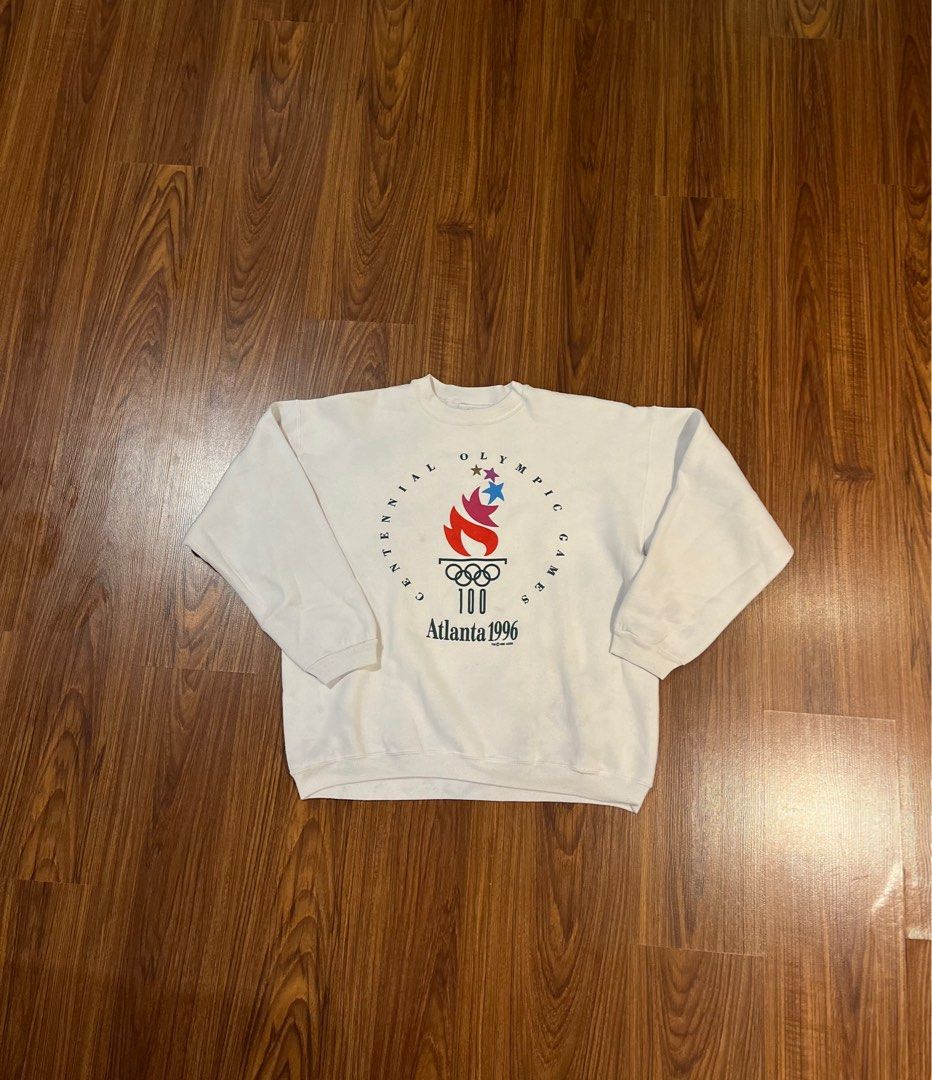 Atlanta Olympics (Category: Hoodies) located in Pasig City. Submitted by ukaygodd (Listing ID 1361257323, Image 1). Description: 1996 Olympics Hanes pull-over . Cotton material, used but not worn-out classic baggy 90s fit. . Size L-XL L27 W25 P800.